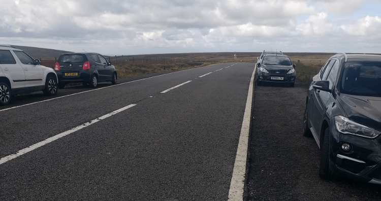 Cars parked on the Snake Pass.